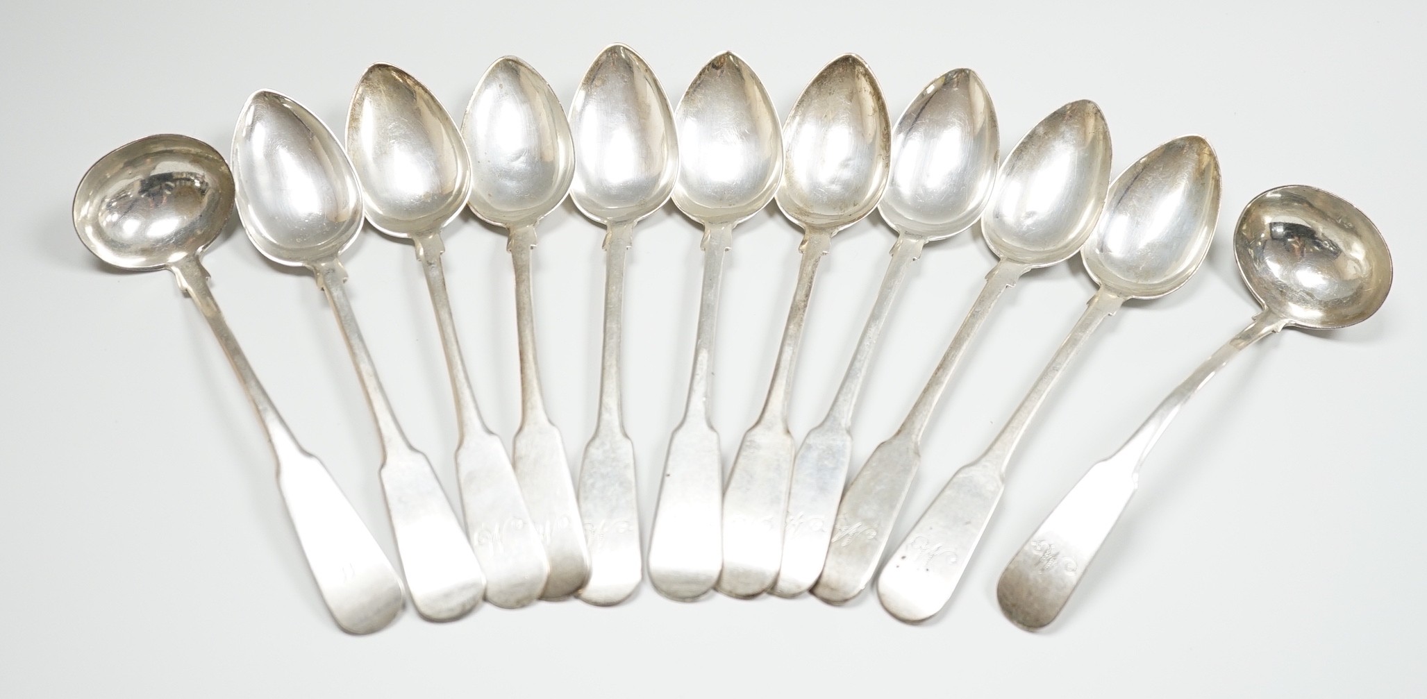 A set of nine early 19th century Scottish provincial silver fiddle pattern dessert spoons, 18.5cm and a pair of sauce ladles, by Alex MacLeod, Inverness, 11oz.